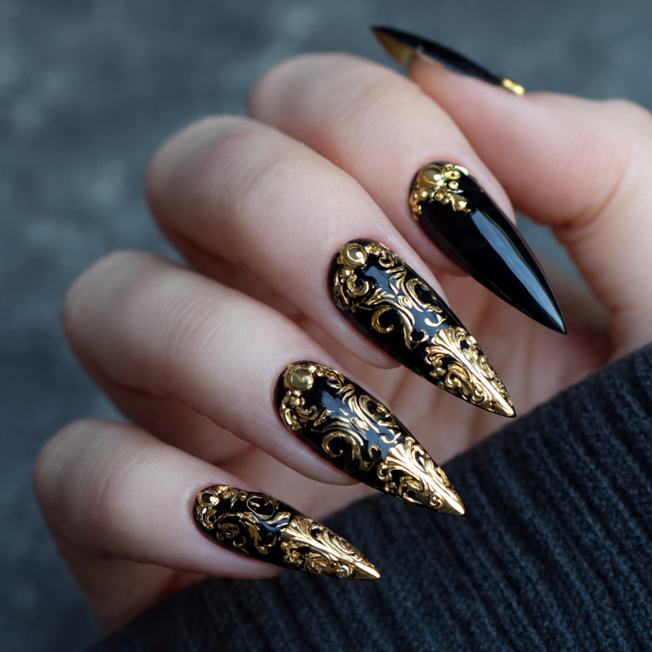 Black Stiletto Nails with Gold Accents