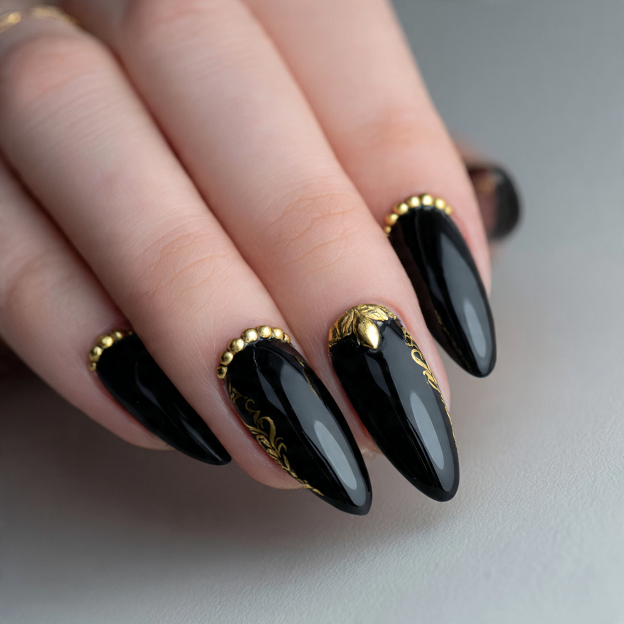 Black Almond Nails with Gold Design